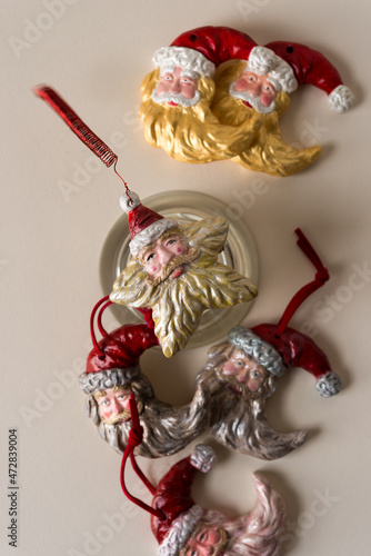 various santa face christmas ornaments on paper