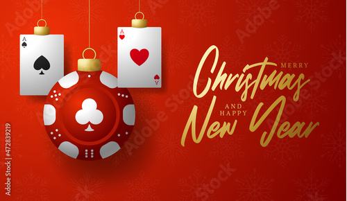 Casino Poker Christmas card. Merry Christmas sport greeting card. Hang on a thread casino poker chip as a xmas ball and golden bauble on red background