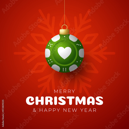 Casino Poker Christmas card. Merry Christmas sport greeting card. Hang on a thread casino poker chip as a xmas ball and golden bauble on red background