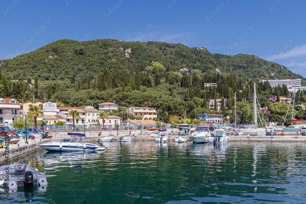 View on Benitses town on the Ionian Sea shore on Corfu Island, Greece