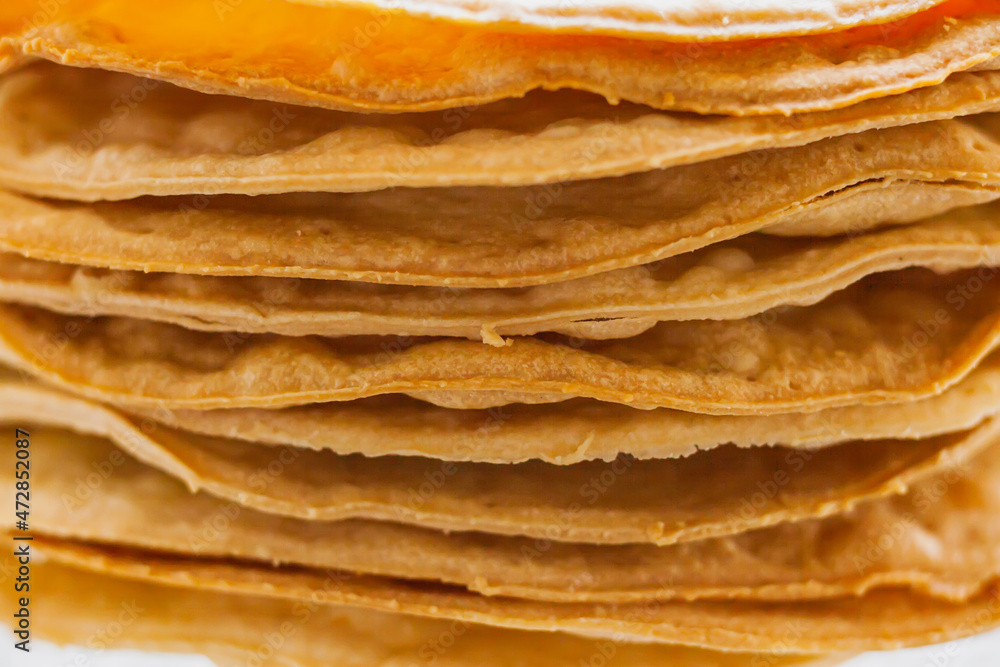 Layers of baked crumpets cakes made of puff pastry for cake. Semi-finished product for cake. Layers of baked crumpets cakes made of puff pastry for cake. Semi-finished product for cake.