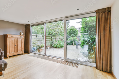 Modern sliding glass doors facing the courtyard