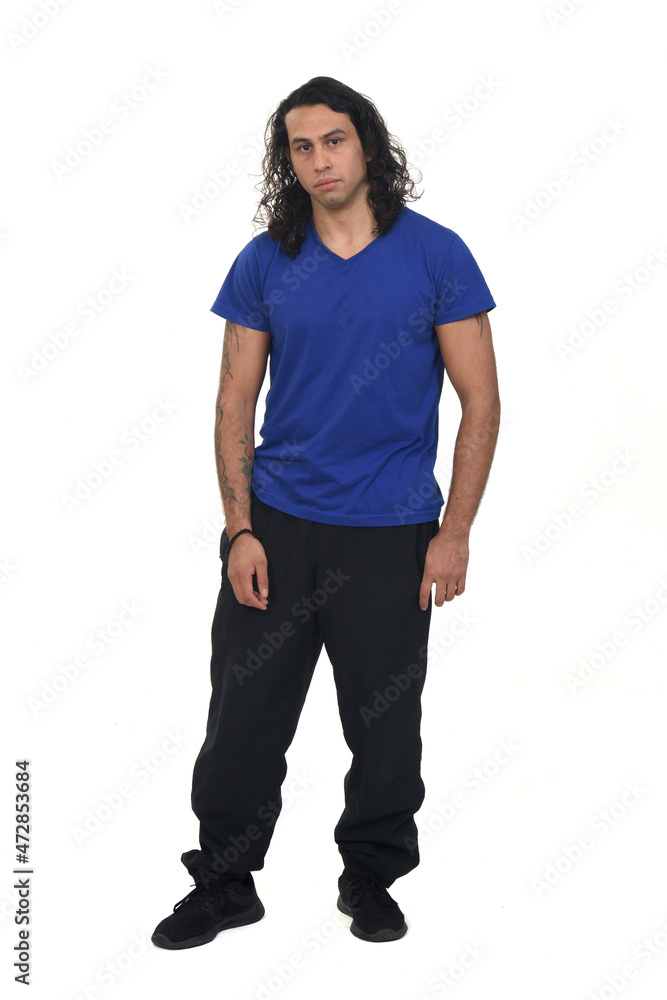 Fototapeta premium front view of a man with sportswear serious and looking at camera on white background