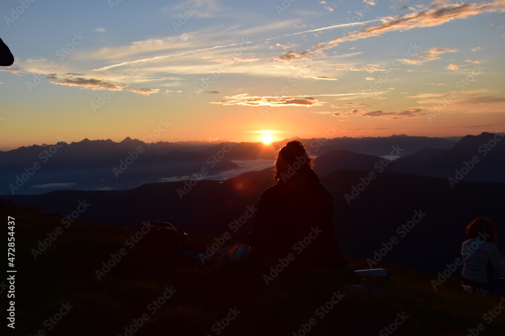 sunset with a person sitting infant of it