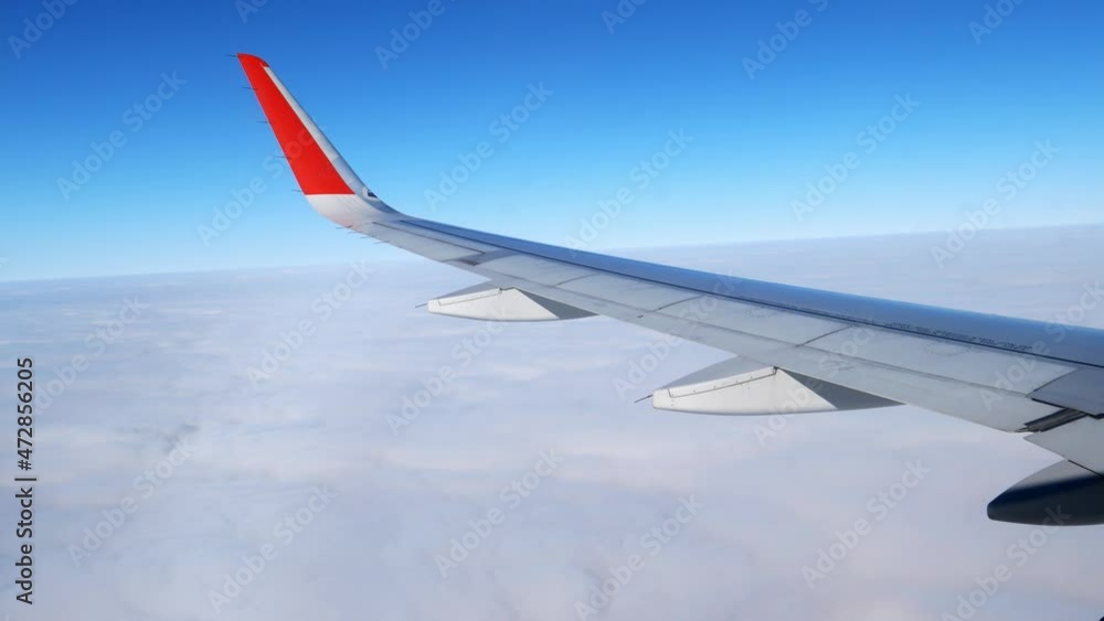 The plane flies through the cumulus clouds. Descent from blue skies into dramatic darkness. The plane flies through the cumulus clouds. Descent from blue skies into dramatic darkness.