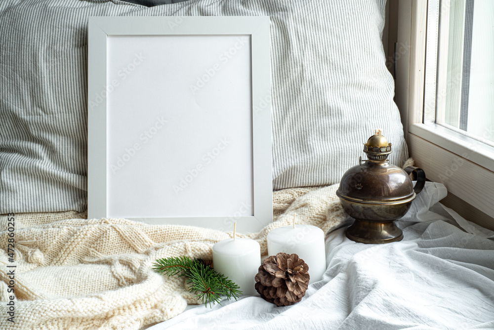 custom made wallpaper toronto digitalCozy winter home interior scene.Christmas composition near the window.Blank white picture frame mockup, oil lamp, candles,pine cone.Model for Christmas menu.