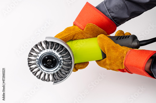 Angle grinder in hands  on white background