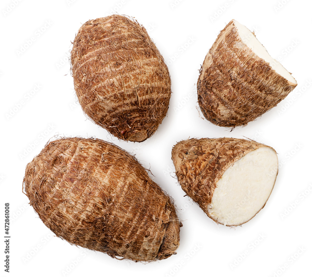 Taro root whole and half on white background, isolated eddo root. Top view Taro root whole and half on white background, isolated eddo root. Top view
