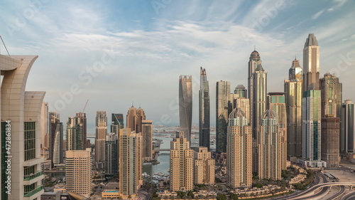 Skyscrapers of Dubai Marina near Sheikh Zayed Road with highest residential buildings morning timelapse