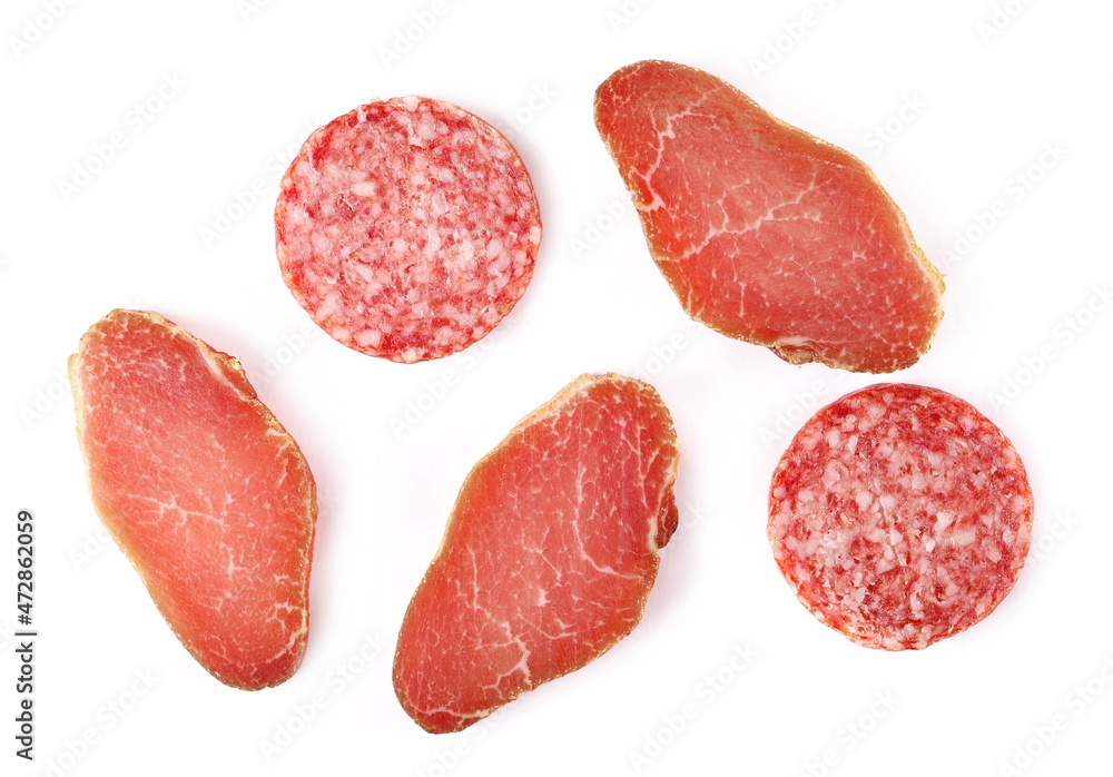 Set salami sausage slices and smoked pork loin isolated on white, top view Set salami sausage slices and smoked pork loin isolated on white, top view
