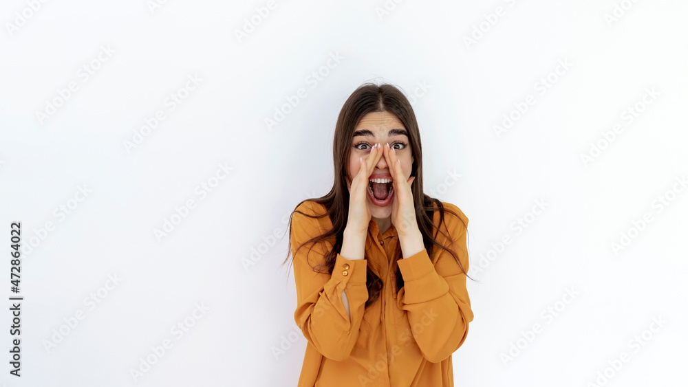 Shot of a beautiful young woman shouting while standing against a grey background. Cropped shot of an attractive young woman shouting in studio against a white background. Copy space. Shot of a beautiful young woman shouting while standing against a grey background. Cropped shot of an attractive young woman shouting in studio against a white background. Copy space.