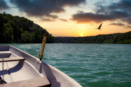 Wallpaper Mural Boat on Green Lakes at Sunset in Vilnius, Lithuania Torontodigital.ca