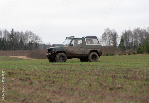 Dirty jeep on the field © Dzmitry