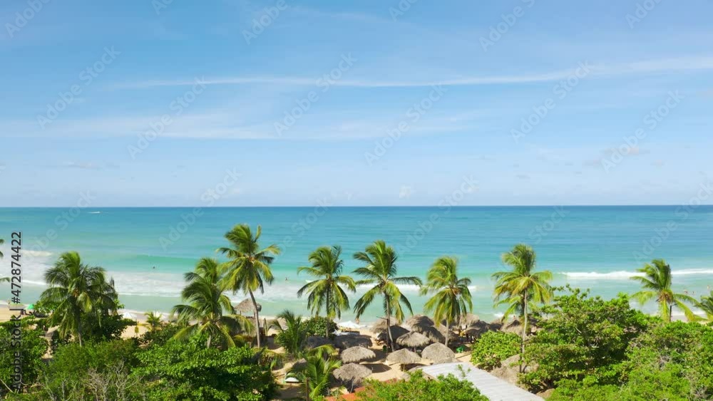 Lush exotic greenery and the blue blue of the sea and sky form a beautiful landscape. Sunny day on the picturesque coast of the Caribbean Sea. An ideal place for beautiful photo shoots. Lush exotic greenery and the blue blue of the sea and sky form a beautiful landscape. Sunny day on the picturesque coast of the Caribbean Sea. An ideal place for beautiful photo shoots.