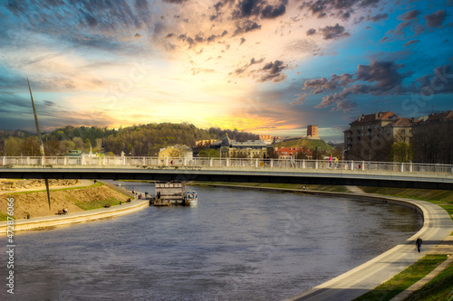 Amazing beauty of the river Neris with a view of Gediminas Castle in Vilnius, dramatic sky, sunrise