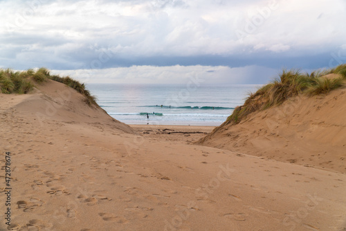 surfers in the beach