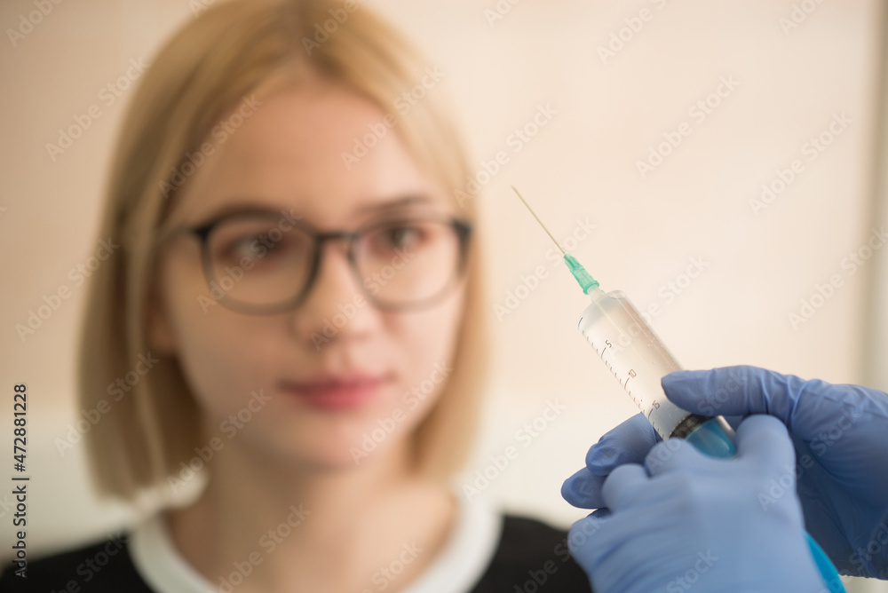 Girl shows she is afraid of injection Girl shows she is afraid of injection