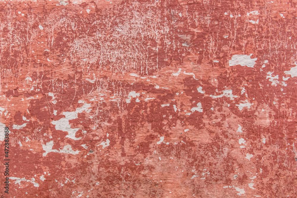 Fototapeta premium Red old peeling paint with concrete or cement surface dirty wall texture background