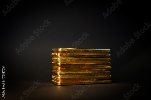 Billede på lærred Gold bullion bars on black background