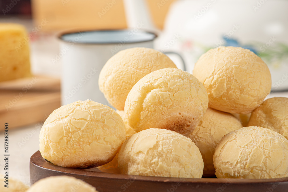 Cheese bread, breakfast table in Brazil, cheese bread, coffee and accessories, selective focus. Cheese bread, breakfast table in Brazil, cheese bread, coffee and accessories, selective focus.
