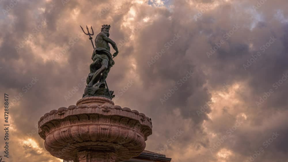 Timelapse of the stormy sky with the fountain of Neptune in the Piazza Duomo in Trento. Trento, autonomous province of Trento, Trentino-Alto Adige, Italy, Europe Timelapse of the stormy sky with the fountain of Neptune in the Piazza Duomo in Trento. Trento, autonomous province of Trento, Trentino-Alto Adige, Italy, Europe