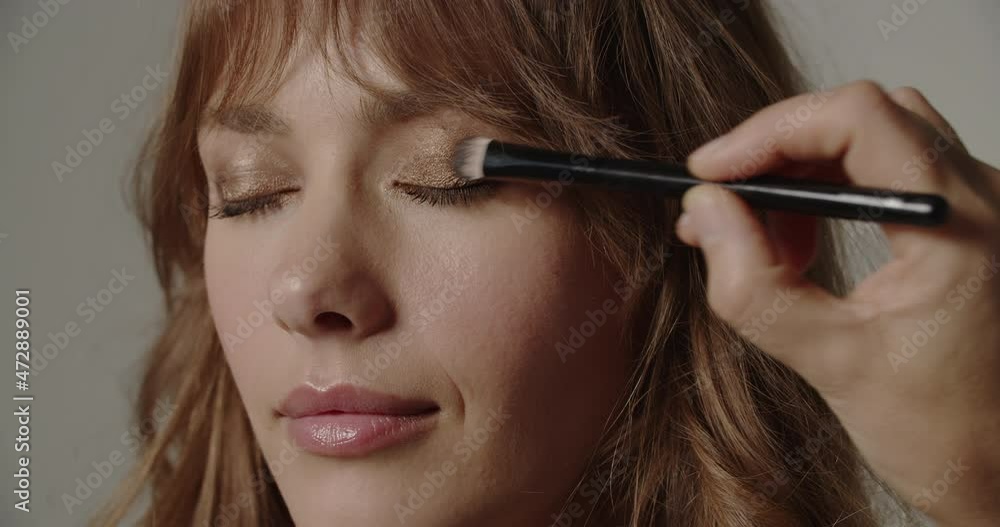 Woman With Eye Shadow Being Applied Woman With Eye Shadow Being Applied