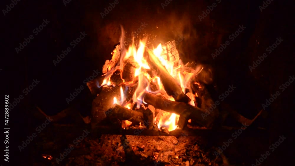 Fire is burning in the fireplace. Hearth. Warmth and home comfort. Flames of a country house. Fire is burning in the fireplace. Hearth. Warmth and home comfort. Flames of a country house.