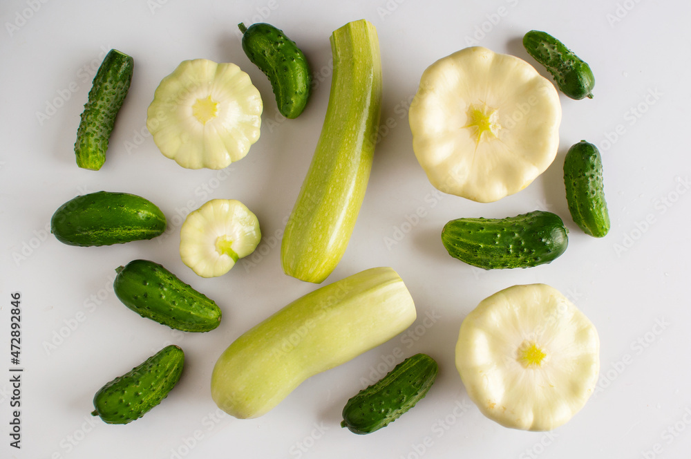 vegetables zucchini, cucumbers and squash on a white background vegetables zucchini, cucumbers and squash on a white background