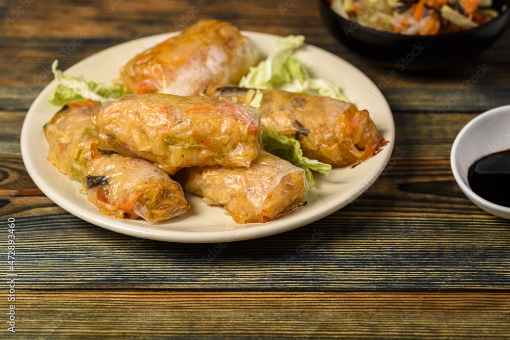 Fototapeta premium homemade spring rolls with vegetables and sauces