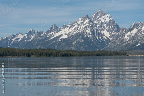 USA, Wyoming, Grand Teton National Park. Summer morning Jackson Lake and a Grand Teton mountain. © Danita Delimont