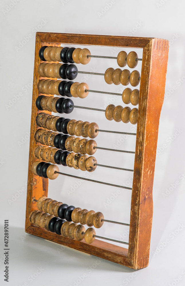 Old wooden abacus on pure white background Old wooden abacus on pure white background