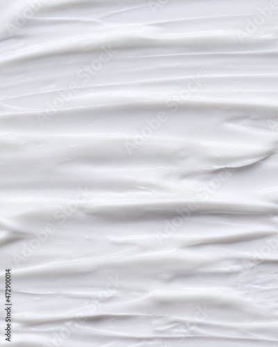 Cosmetics white face cream texture smudged with fingers