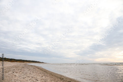 Beautiful seascape shore view with sand and Baltic sea.