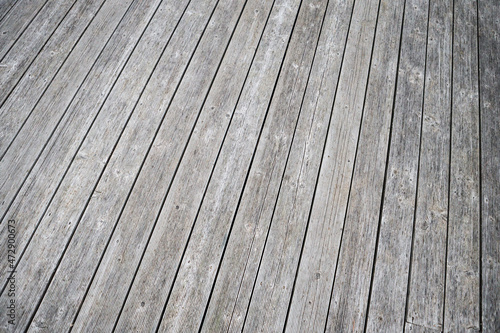 Dark grey nailed wood path texture platform stage artistic background.