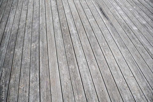 Dark grey nailed wood path texture platform stage artistic background.