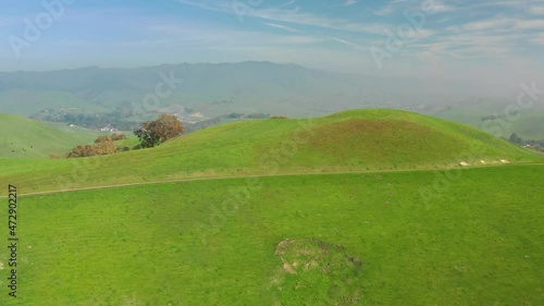 landscape with green grass and blue sky drone aerial