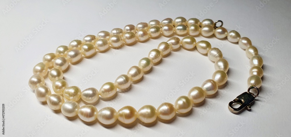 A beautiful necklace made of natural pearls. Pearl jewelry for women. Precious stones. A beautiful necklace made of natural pearls. Pearl jewelry for women. Precious stones.