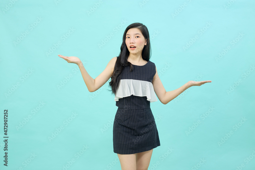 Beautiful young woman is holding hands raised Beautiful young woman is holding hands raised