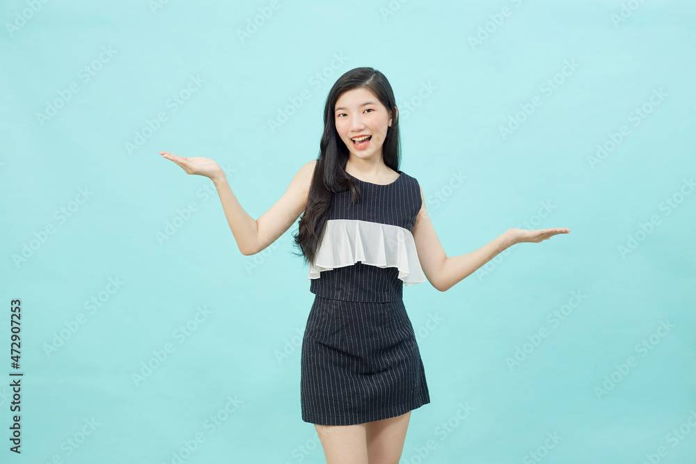 Beautiful young woman is holding hands raised Beautiful young woman is holding hands raised