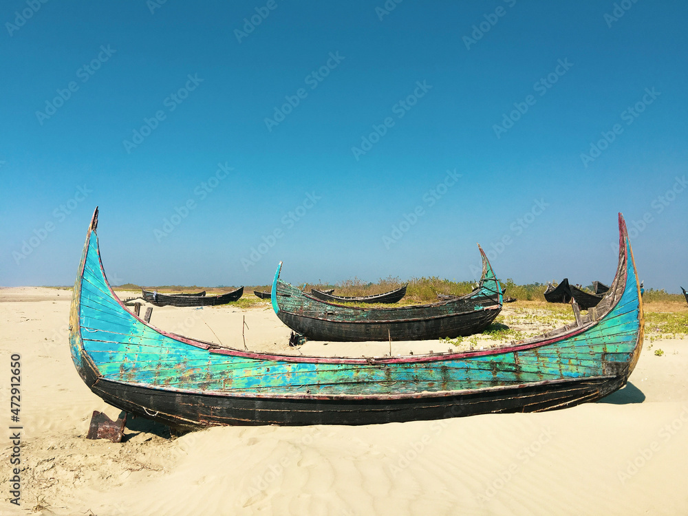 Abandoned boats on a beach in Myanmar. Abandoned boats on a beach in Myanmar.