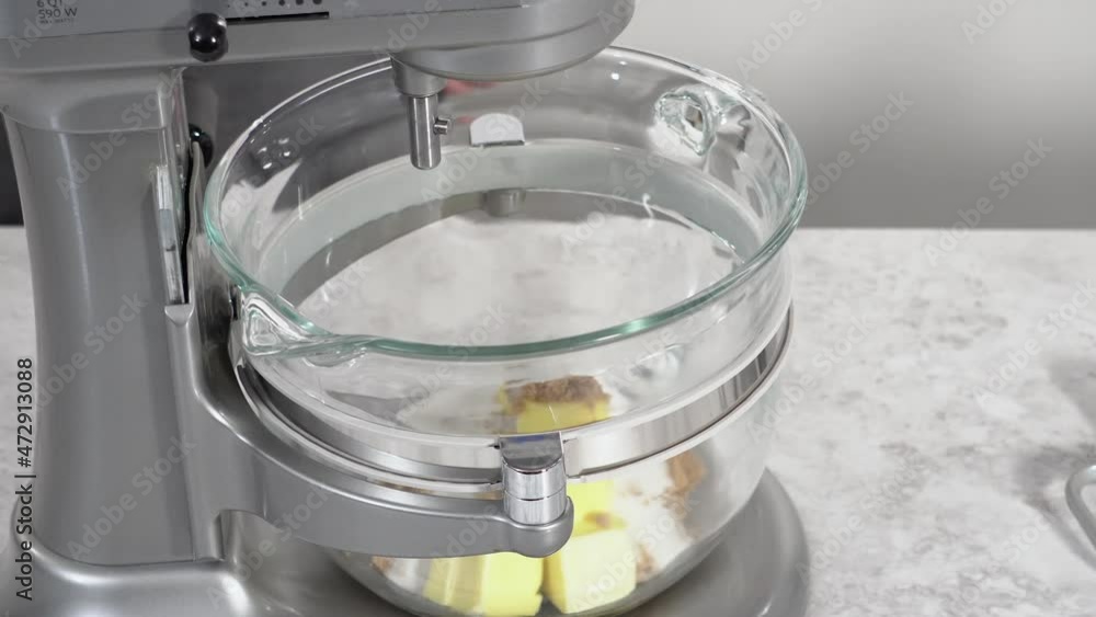 Mixing ingredients in standing kitchen mixer to prepare unicorn chocolate chip cookies. Mixing ingredients in standing kitchen mixer to prepare unicorn chocolate chip cookies.