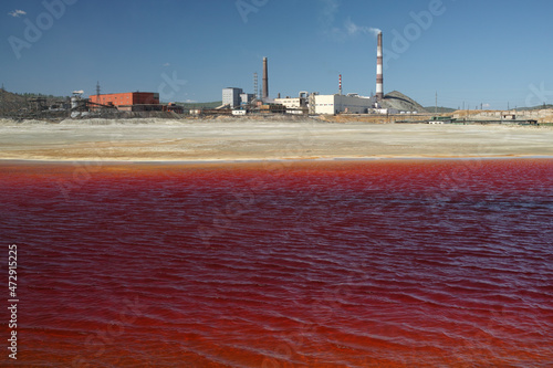 Red water of the lake contaminated with copper smelting waste.
