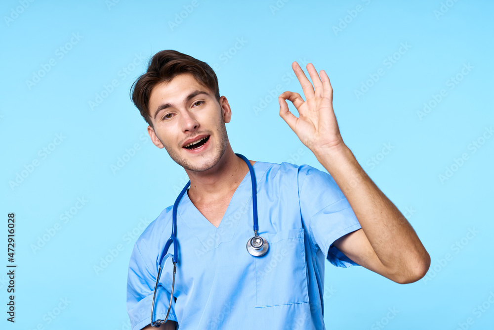 man in medical uniform stethoscope examination work blue background man in medical uniform stethoscope examination work blue background