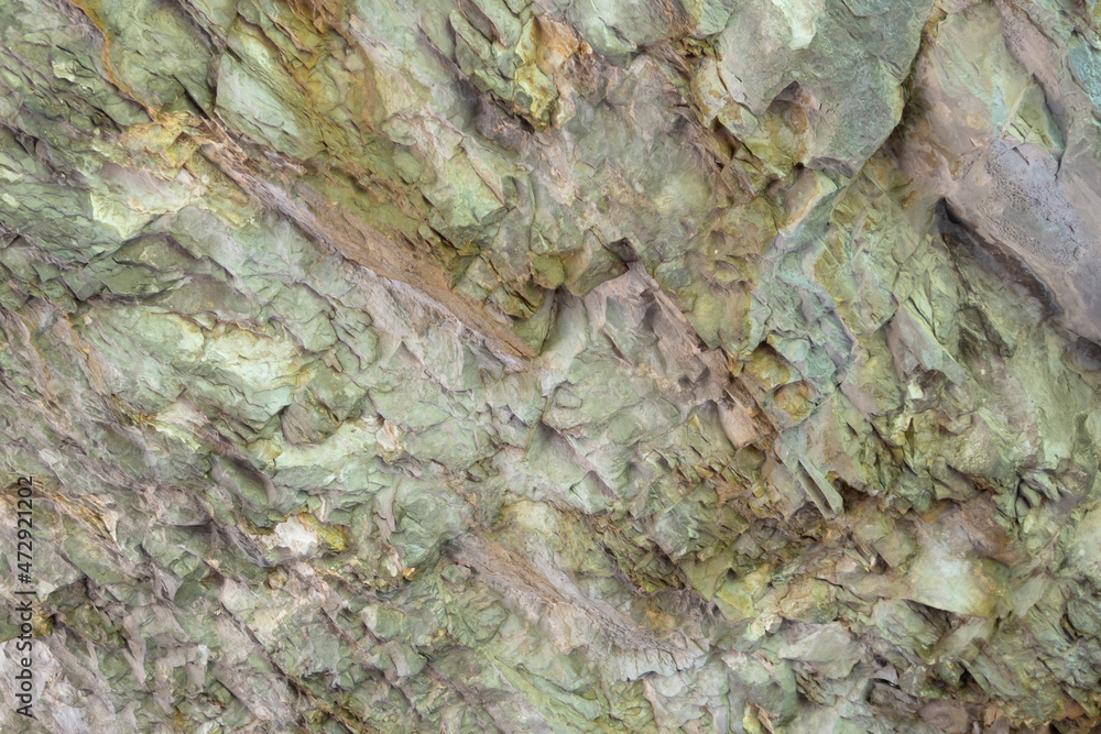 Obraz premium Abstract background. Stone formation of a sheer cliff close-up.
