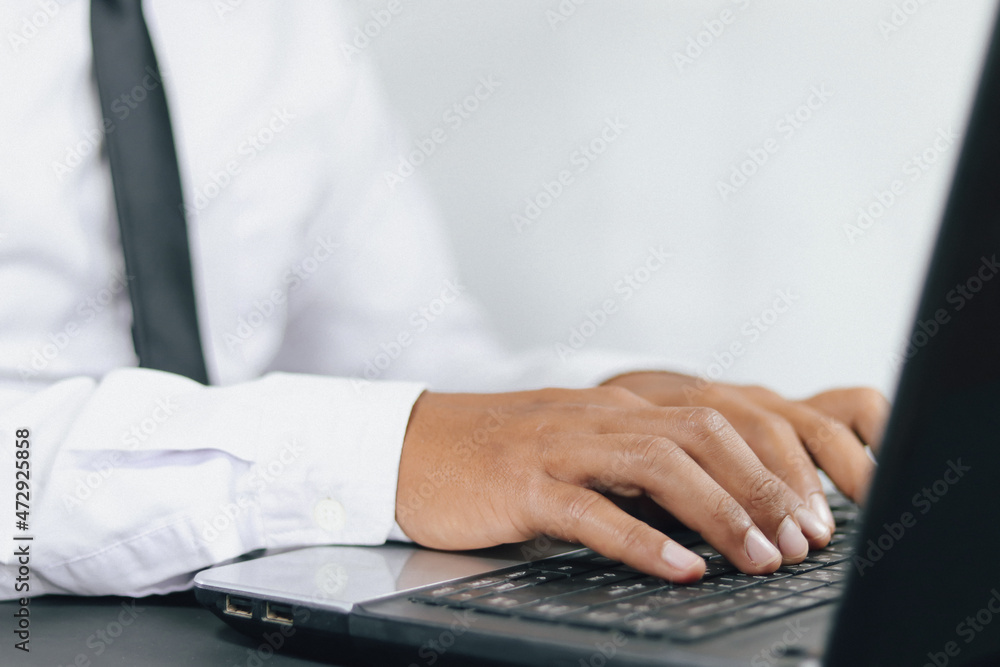 close up hand of Businessman typing on keyboard or laptop close up hand of Businessman typing on keyboard or laptop