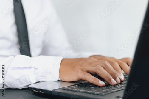 close up hand of   Businessman typing on keyboard or laptop