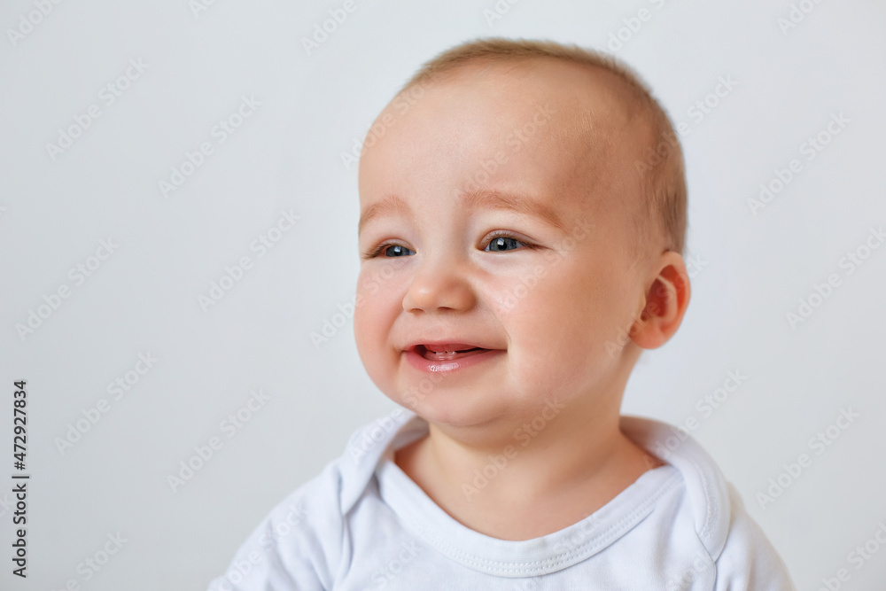 Large portrait portrait of a smiling child on a white background.