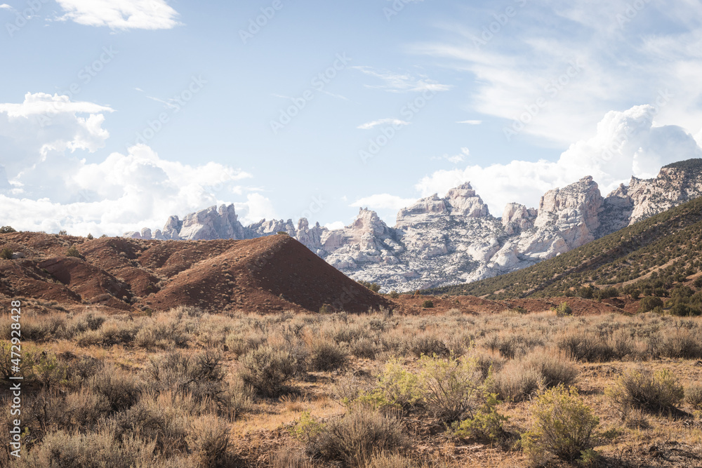The beautiful view cloudy sky, red and green canyon in Colorado. The incredibly colorful background The beautiful view cloudy sky, red and green canyon in Colorado. The incredibly colorful background