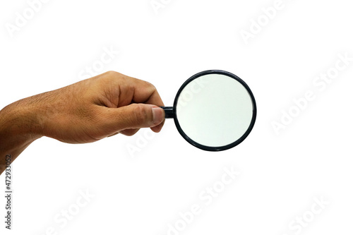 Cut out of hand holding a magnifying glass  isolated on white background with clipping path.