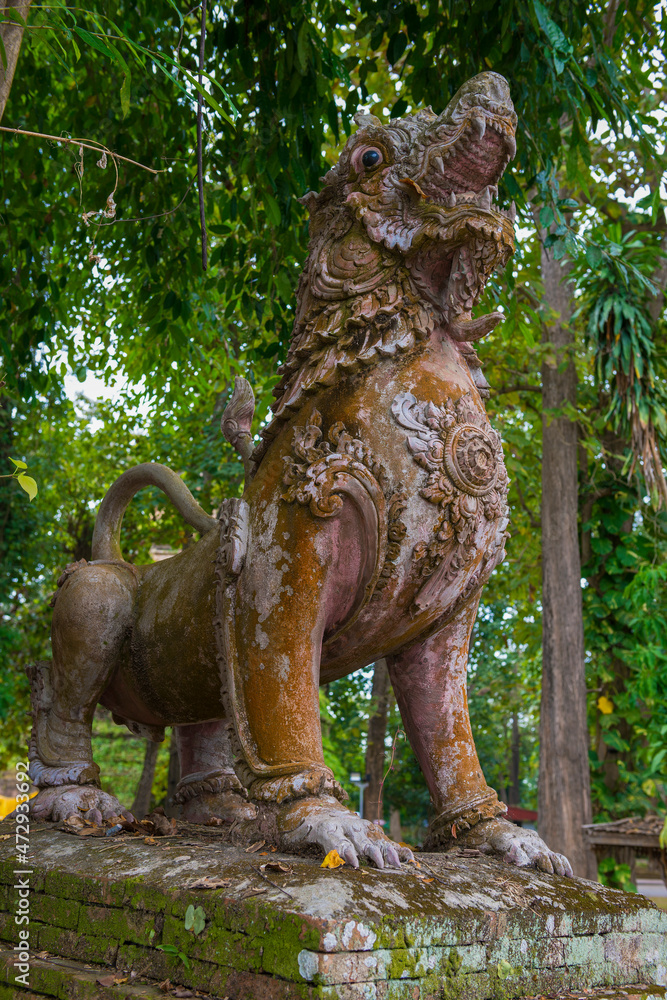 Ancient dragon sculpture on the ruins of Wat Phrathat Chedi Luang Buddhist temple. Chiang Saen, Thailand